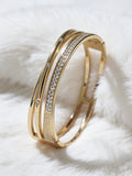 Gold Layered Crossover Bangle With Stones